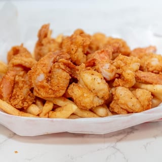 3  fried fish with 3 shrimps and fries